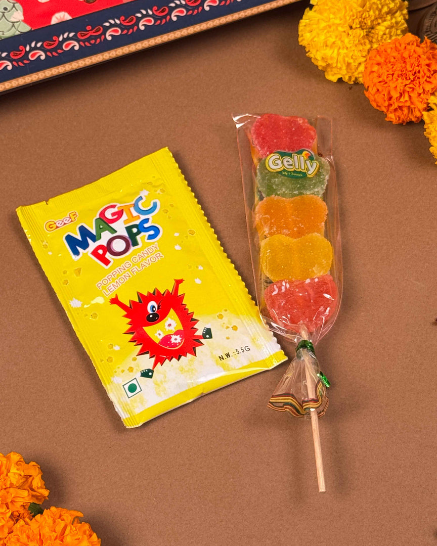 Hair accessory and sweet treats from Rakhi Gift Hamper - Naman Arts