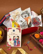 Load image into Gallery viewer, Tradition and Charm Rakshabandhan hamper full contents flatlay - Naman Arts