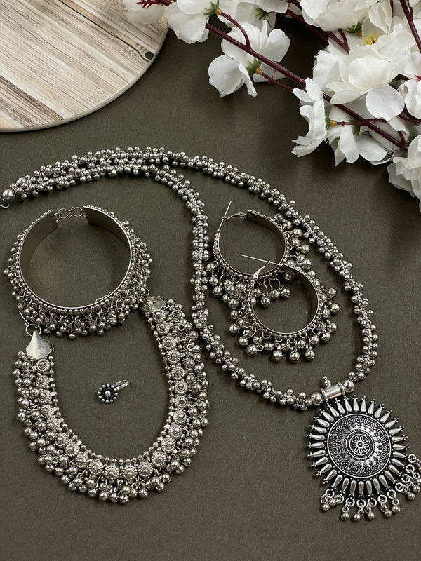 Oxidised crafted ghungroo jewelry set including a Sun Pendant , choker, earrings , ring, nosepin, and kada, all made with intricate ghungroo detailing and traditional design.