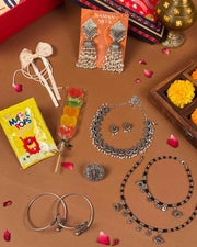 Rakhi Gift Hamper full contents flatlay - Naman Arts