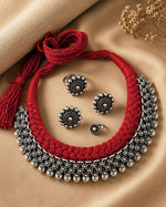 Load image into Gallery viewer, Traditional oxidised silver choker necklace set with red thread design, matching earrings, ring, and nose pin for ethnic wear.