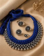 Load image into Gallery viewer, Traditional oxidised silver choker necklace set with blue thread design, matching earrings, ring, and nose pin for ethnic wear.